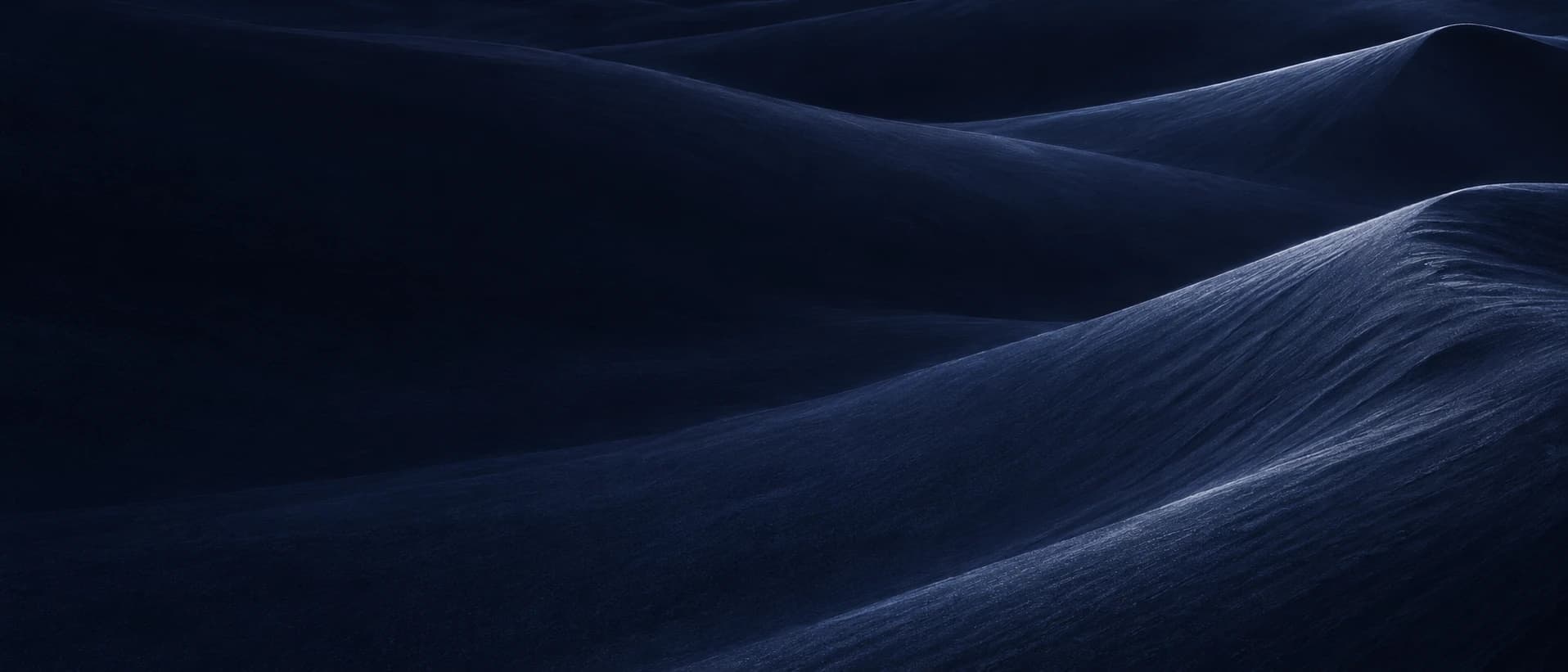 Moonlit sand dunes with soft ridges