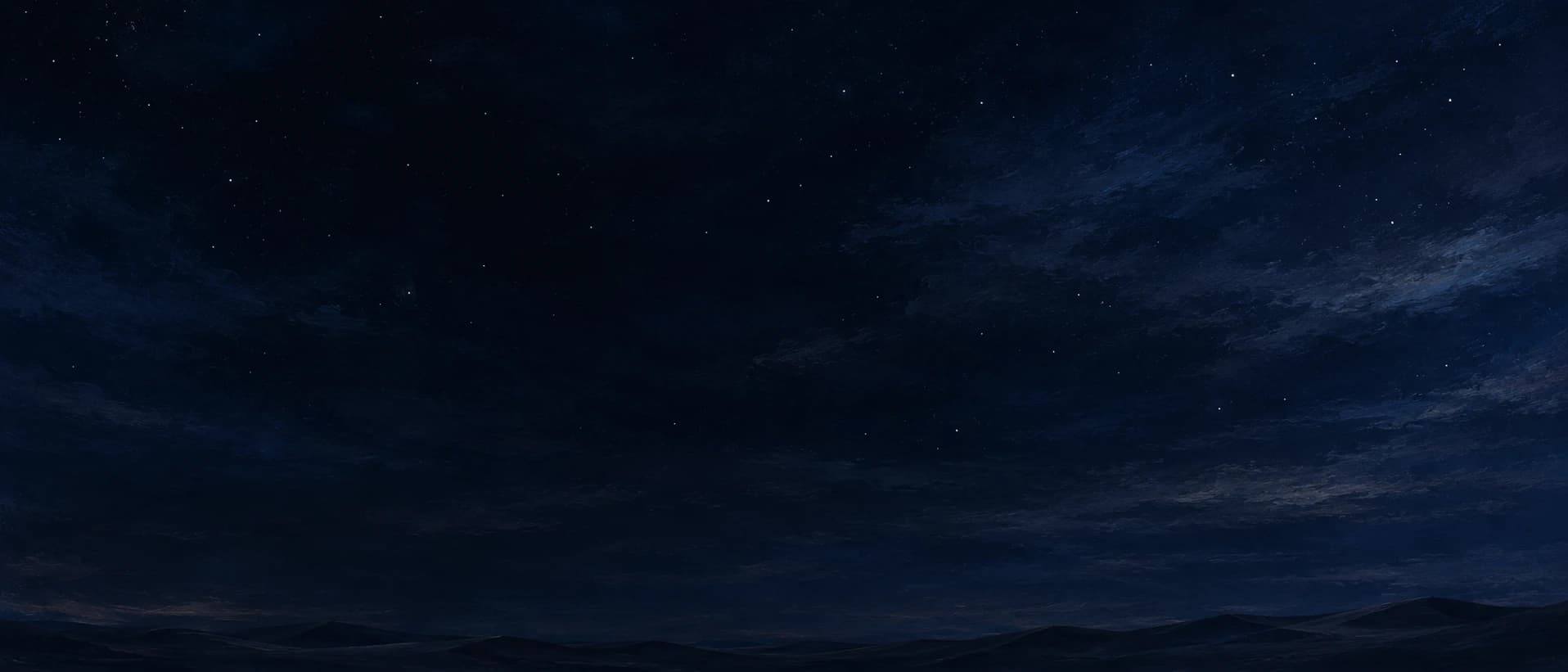 Starry night sky above low desert hills